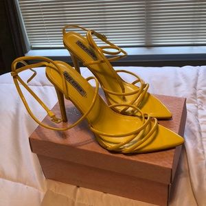 Yellow pointy heels